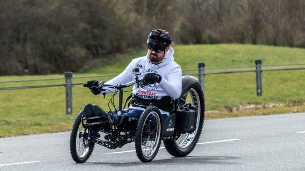 Martin Hibbert riding in a custom-built handbike