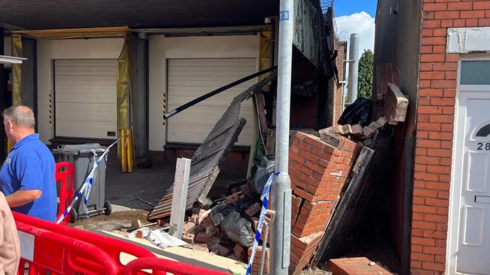 Bakery front smashed by car