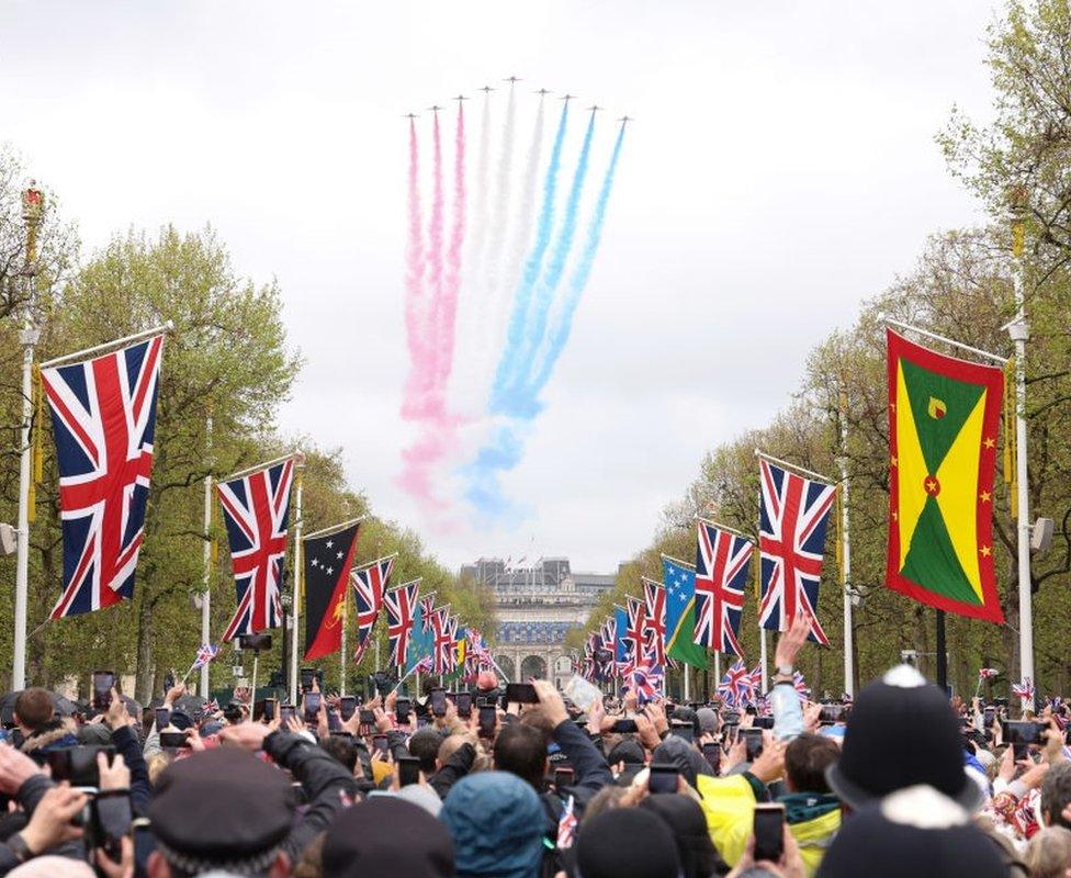 The Red Arrows, based at RAF Waddington, fly over Buckingham Palace