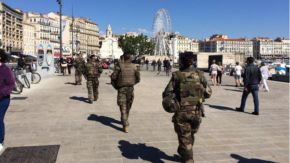 Soldiers patrolling along the waterside in Marseille