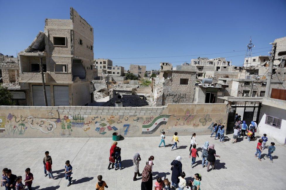 Children finish their first day of school in the rebel-held Syrian town of Maarat al-Numan, Syria (24 September 2016)