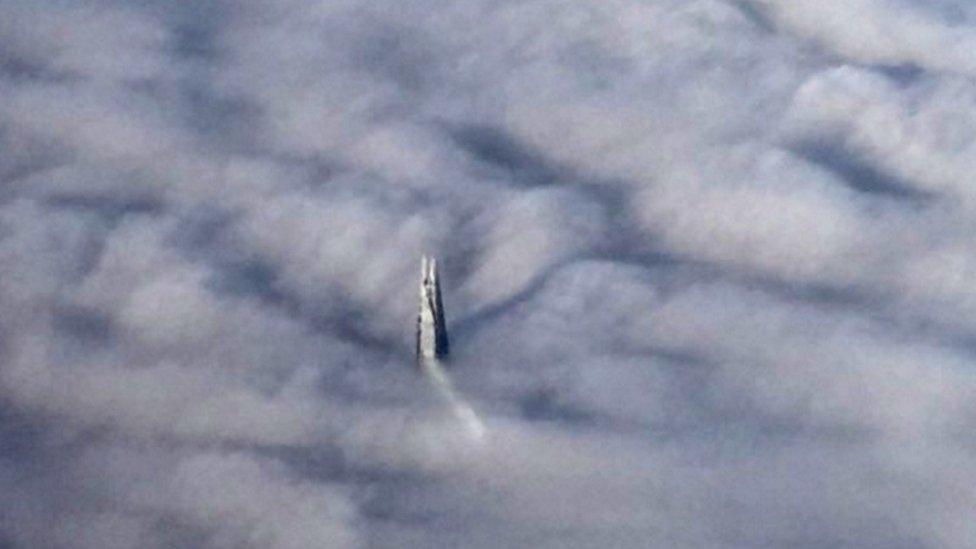 Top of the Shard emerging from fog