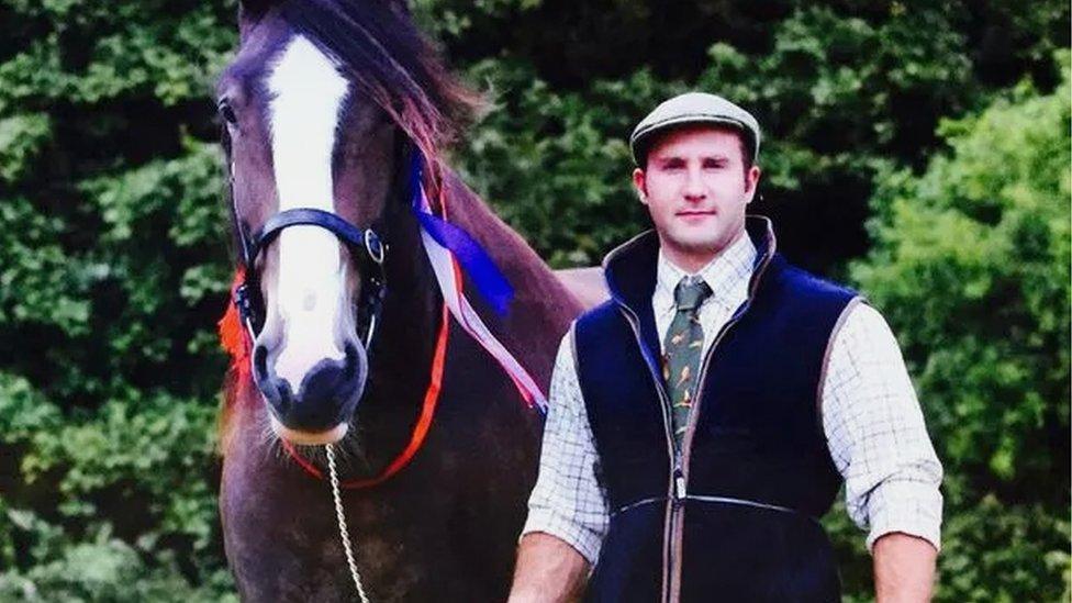 Scott Manson stood next to a horse