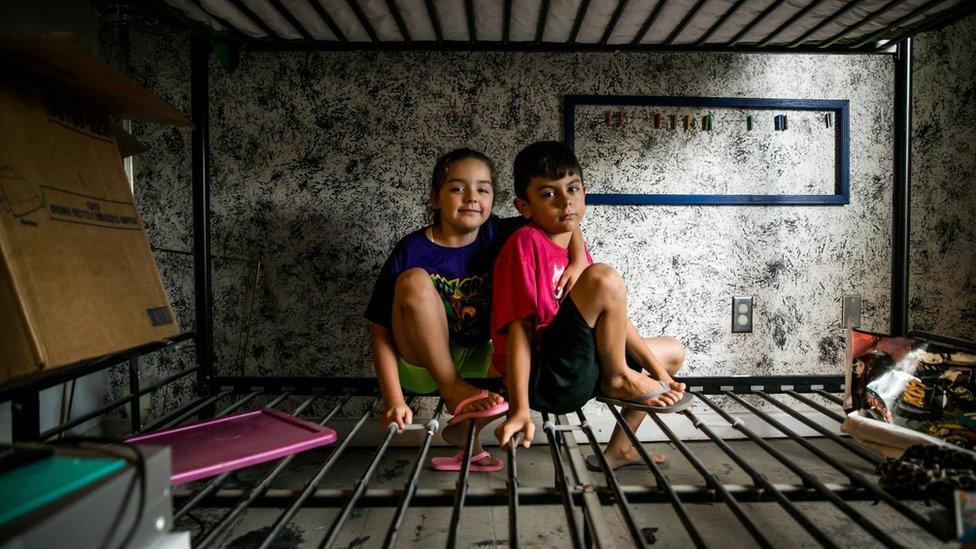 Aiden and his little sister, Jubilee, sit on what's left of their bunk beds in the Baton Rouge home that was new to them just months ago. Their mother, Mimi, said: "Today we're going to call it an early day so that Aiden can celebrate his birthday, because not even this flood should get in the way of that."