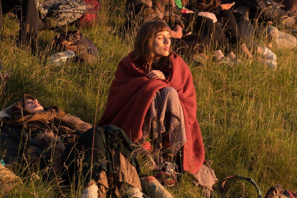 People gather at Avebury Neolithic henge monument, a UNESCO World Heritage site, for the summer solstice