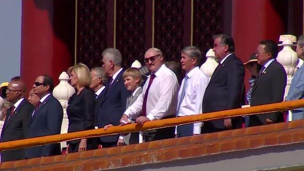 Kolya and Alexander Lukashenko watch Beijing's massive military parade on 3 September