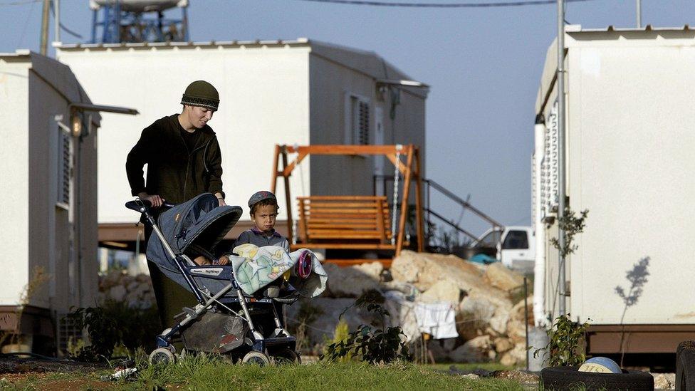 Woman and children at outpost of Migron (file photo)