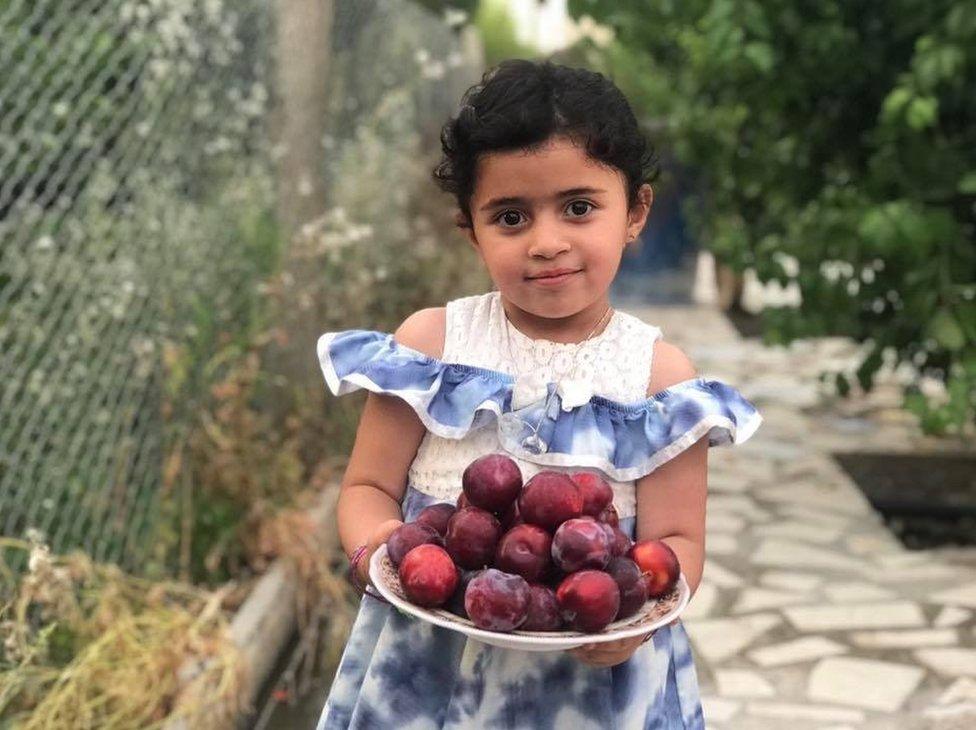 Girl with plums