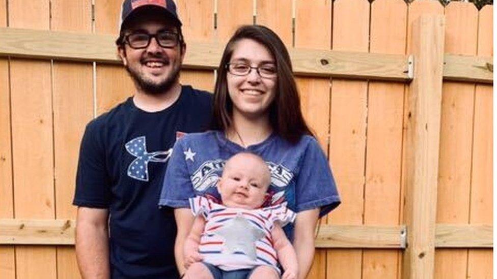 Kristen Haddox and her husband with baby