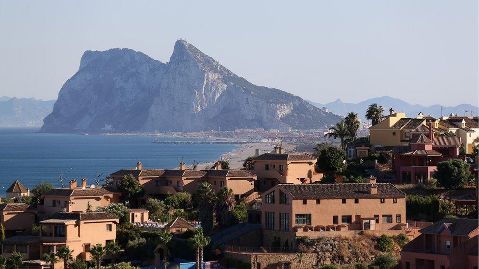 Modern apartments cover the hillside in front of the Rock of Gibraltar