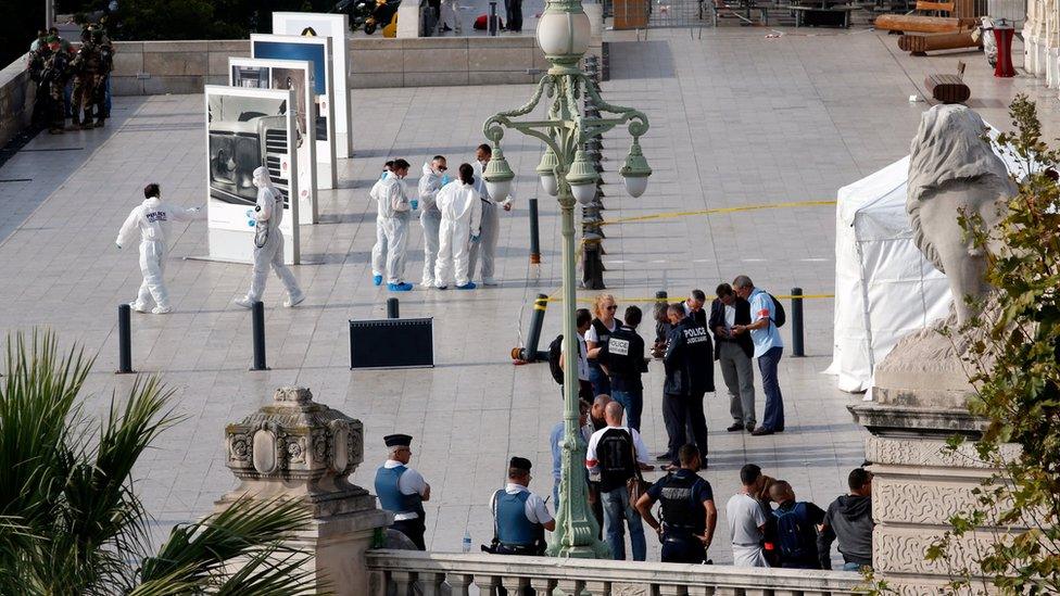 Police investigators work outside the Saint Charles train station after French soldiers shot and killed a man who stabbed two women to death at the main train station in Marseille, France (October 1, 2017)