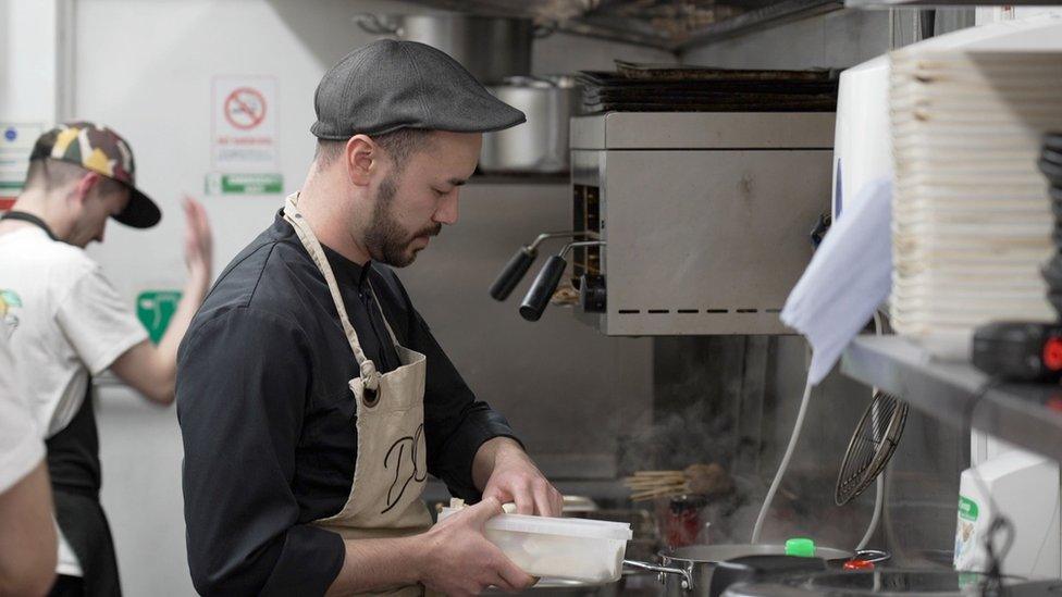 Chef Daniel Lee preparing food