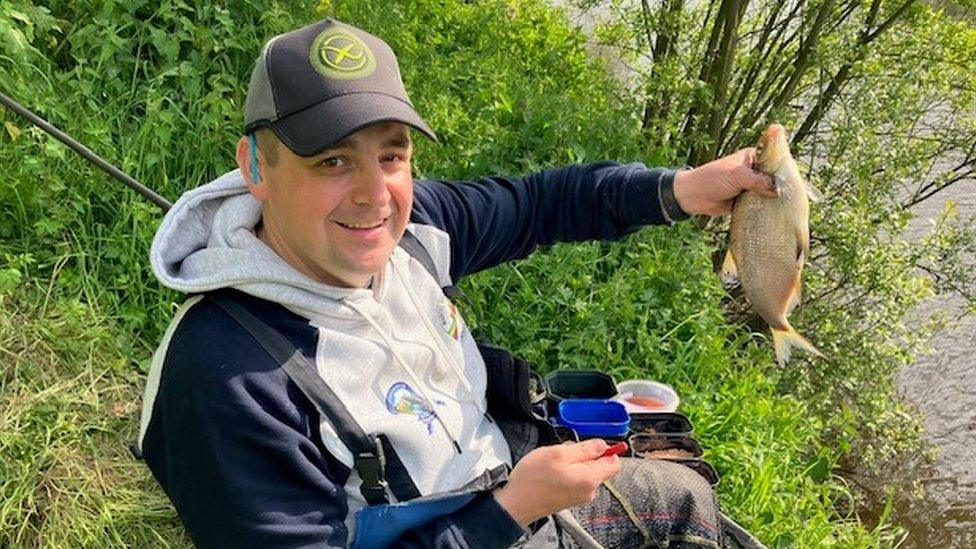 Johnny McKinley holding a fish