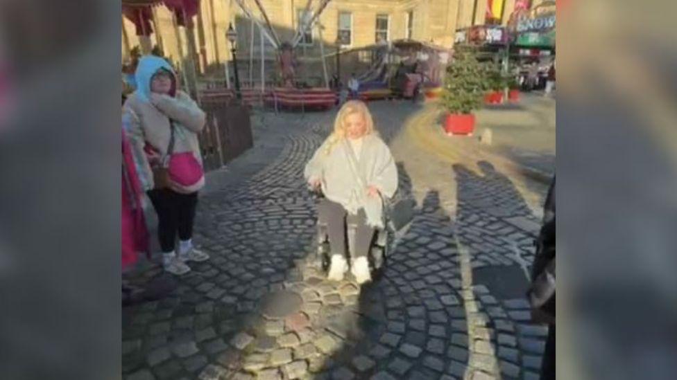 Lisa McCann who is using a wheelchair and on cobbles in Liverpool's Christmas market