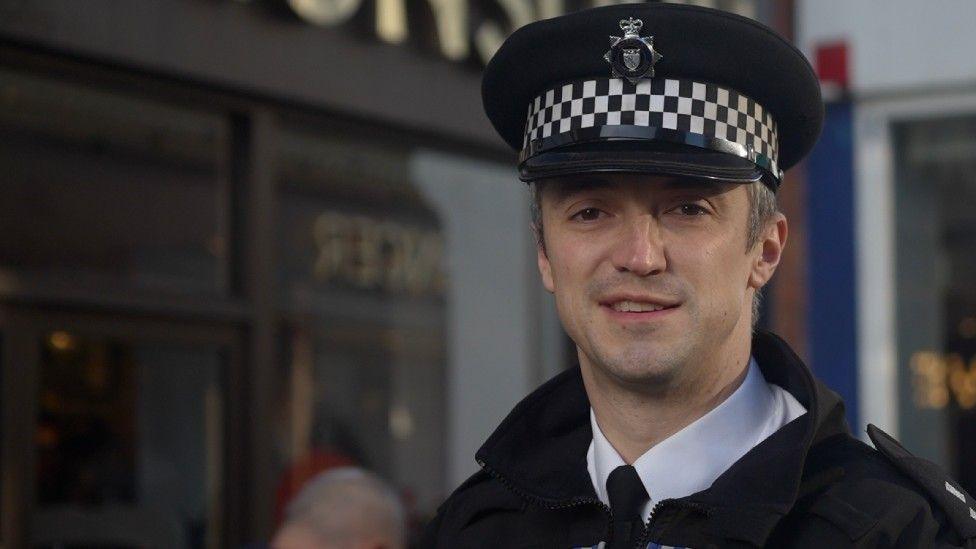 Insp Ben Jarvis from Norfolk Police in police uniform and hat.