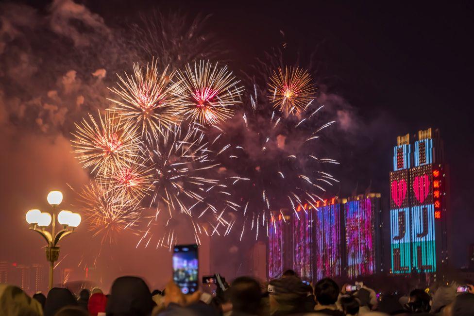 Fireworks light up the sky over the Songhua River during a firework show to welcome New Year 2025 on New Year's Eve on December 31, 2024 in Jilin City, Jilin Province of China. 