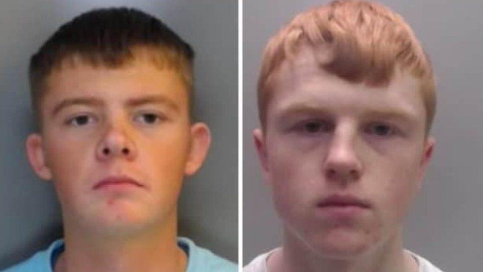 Mugshots of two young men. One has short dark hair and is wearing a blue shirt, the other is pale with red hair.