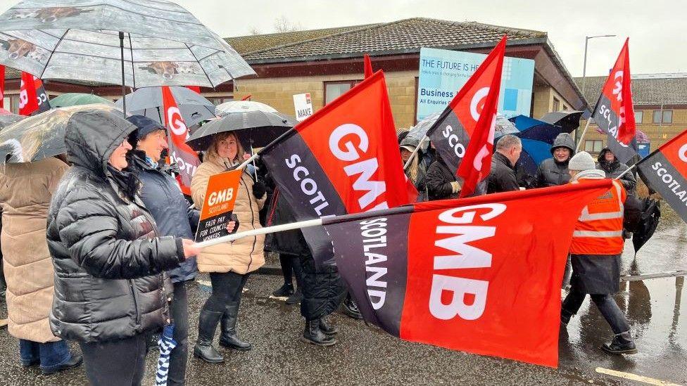 Striking workers on a picket line in Denny, near Falkirk