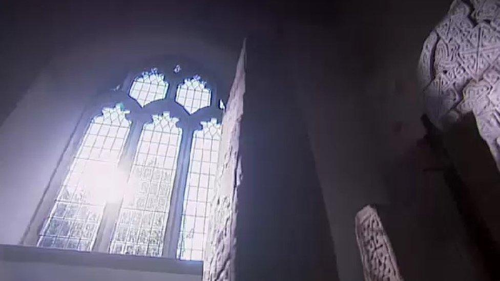 A view from St Illtud’s Church with sunlight coming through a high window