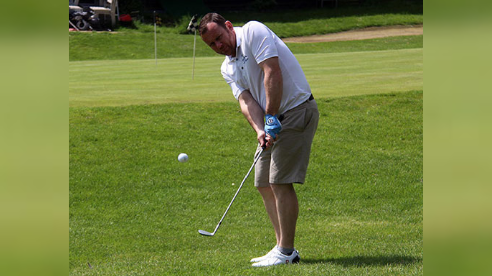 Paul Sullivan playing golf