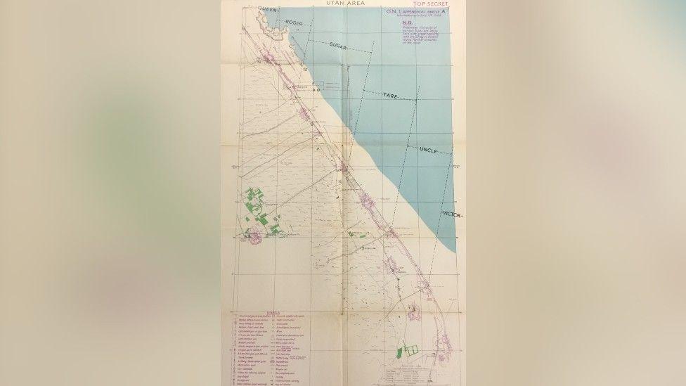 A map of the area around Utah beach in Normandy, France. It is marked as "top secret" and features markings in purple, green and black.