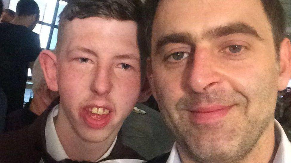 A selfie-style shot showing David Church next to the snooker player Ronnie O'Sullivan.