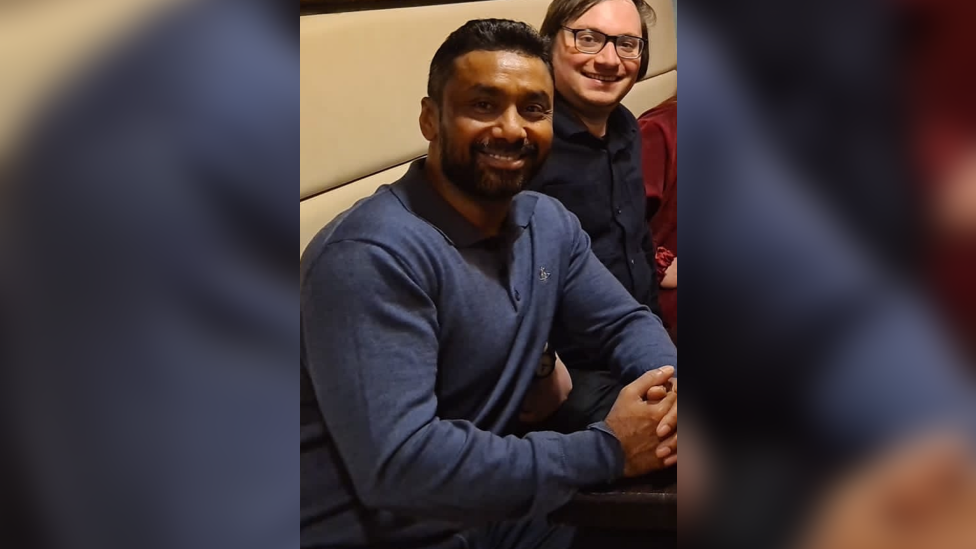 Luthfur Rahman sitting on a sofa with Owen Franklin