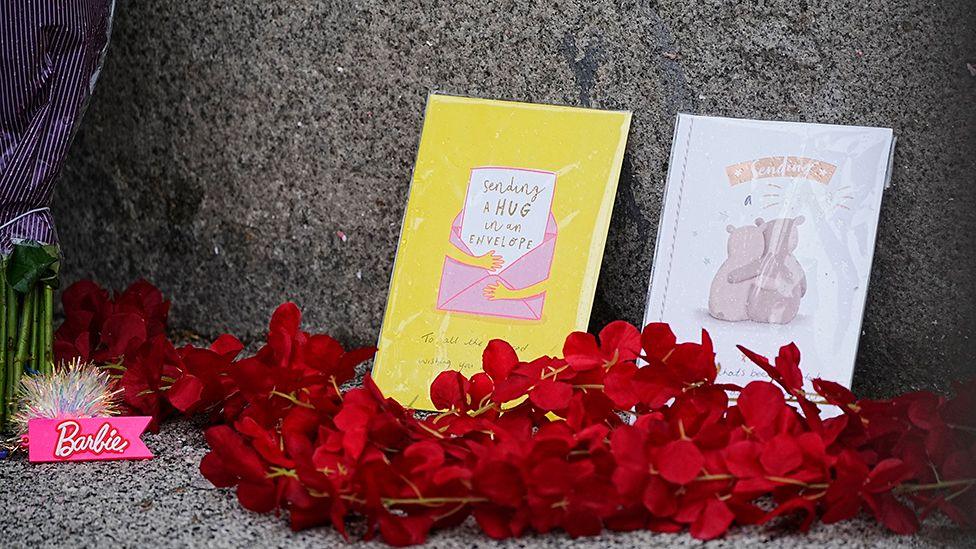 A view of flowers and tributes at the scene in Water Street near the Liver Building in Liverpool