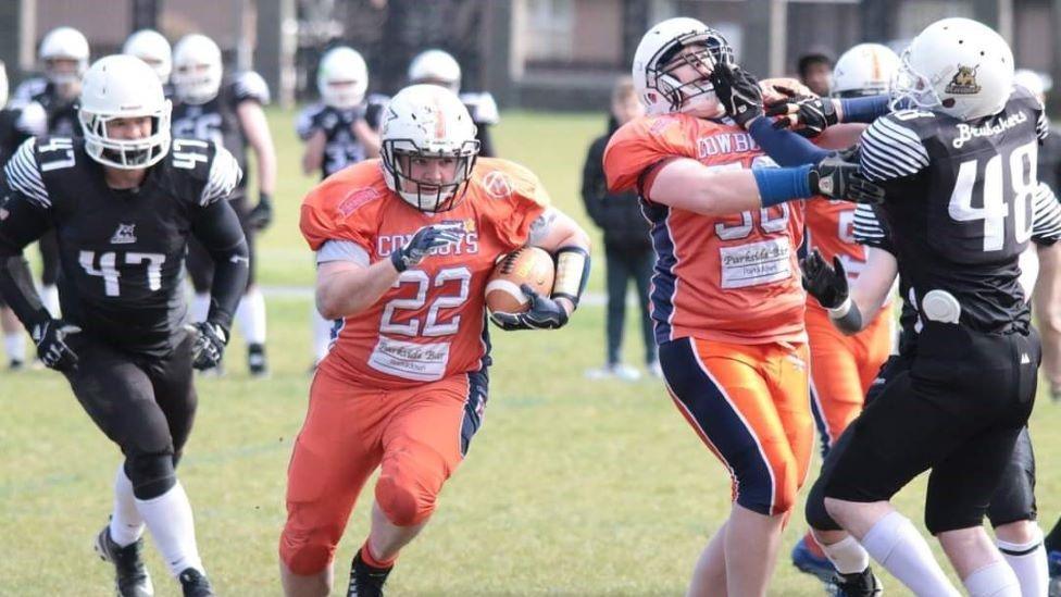 Jo Buchannan playing American football