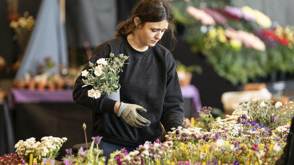 Woman arranging flowers at Harrogate Flower Show