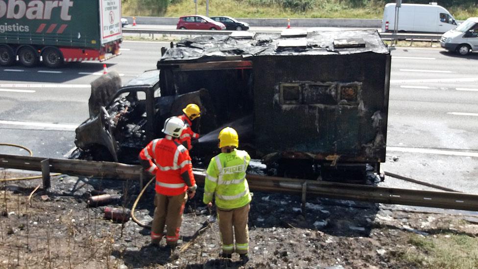 The burned-out prison van