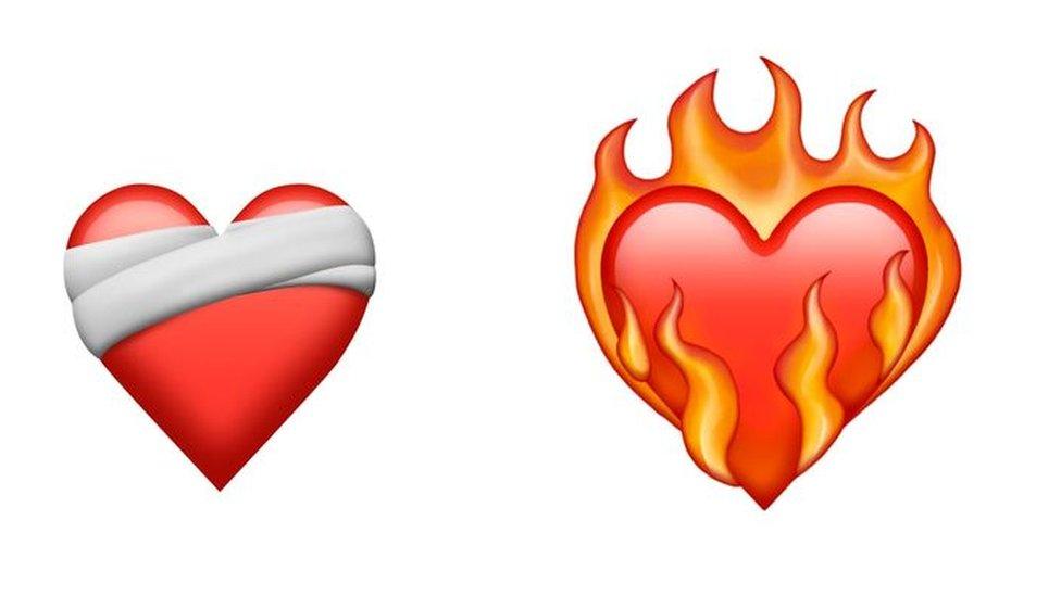 new emojis mending heart with bandage on and heart on fire.