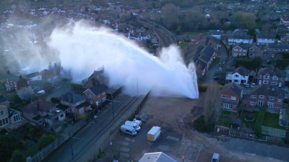 A punctured water main releasing water and flooding streets in the Midlands (c) Newsflare