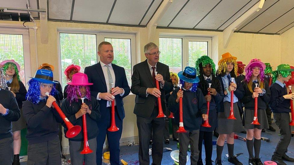 First Minister Mark Drakeford and the Education minister Jeremy Miles join in with pupils playing the horn