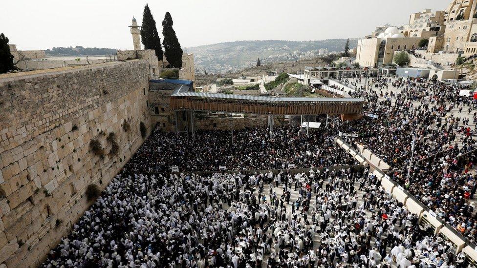 Jewish worshippers gather at the Western Wall in Jerusalem's Old City on 13 April 2017