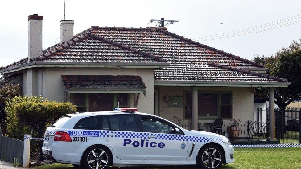 A police car outside a house in Perth where the five victims were found