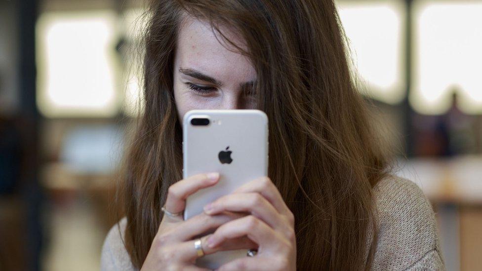 Girl takes selfie with iPhone 7