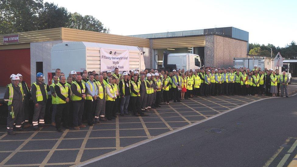 Staff pictured with the last nuclear flask to leave Wylfa on Anglesey