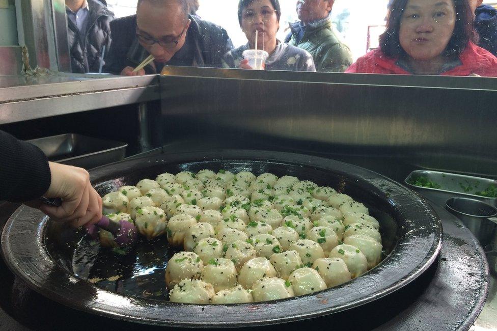 Pan full of frying dumplings