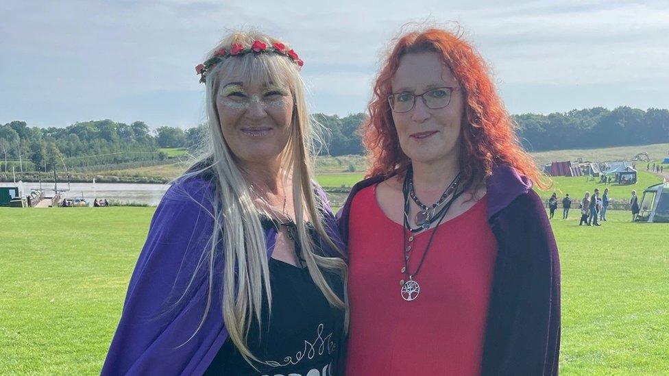 Two witches in a field