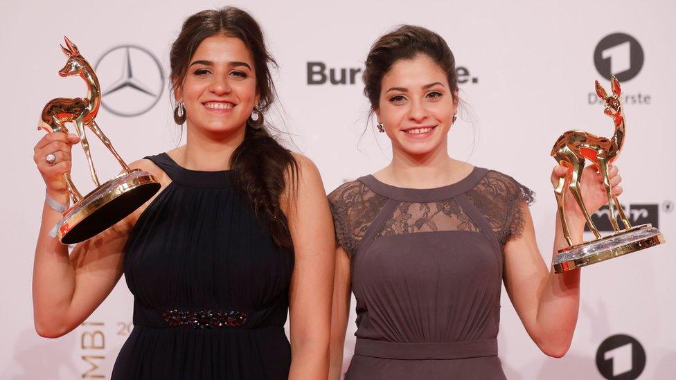 Syrian refugees and swimmers Yusra and Sarah Mardini pose for photographers at the Bambi awards, the main German media awards, 17 November 2016