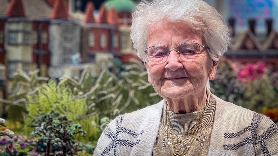 Margaret Seaman by her knitted Sandringham Estate