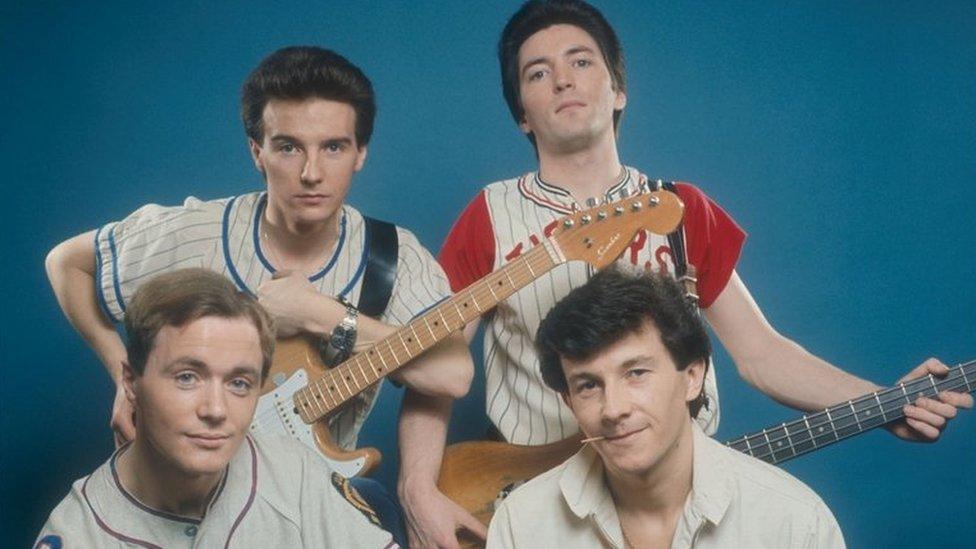 Midge Ure - pictured top left, with guitar - with bandmates from Slik