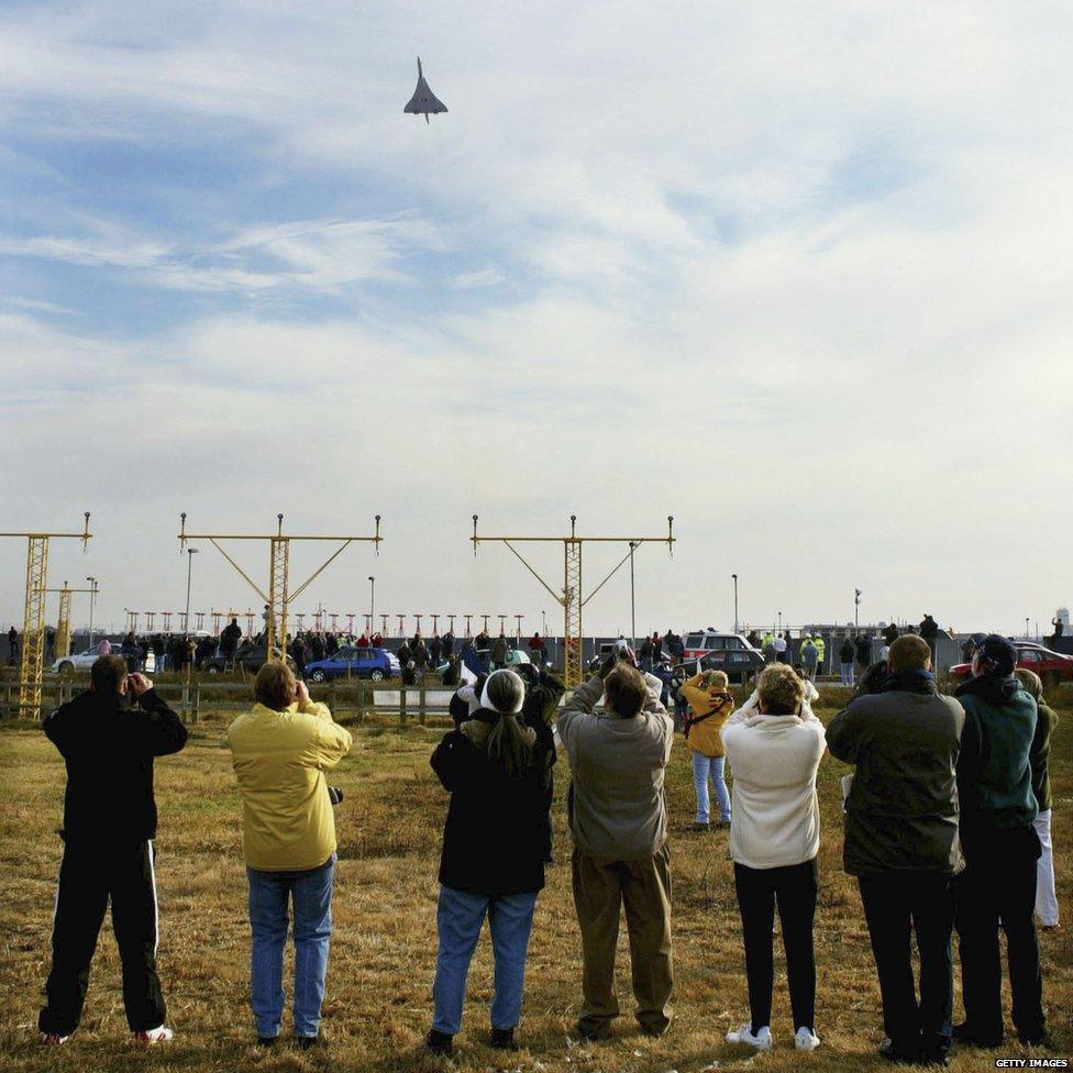 Spectators watch the last Concorde take off from Heathrow Airport, 24 October 2003