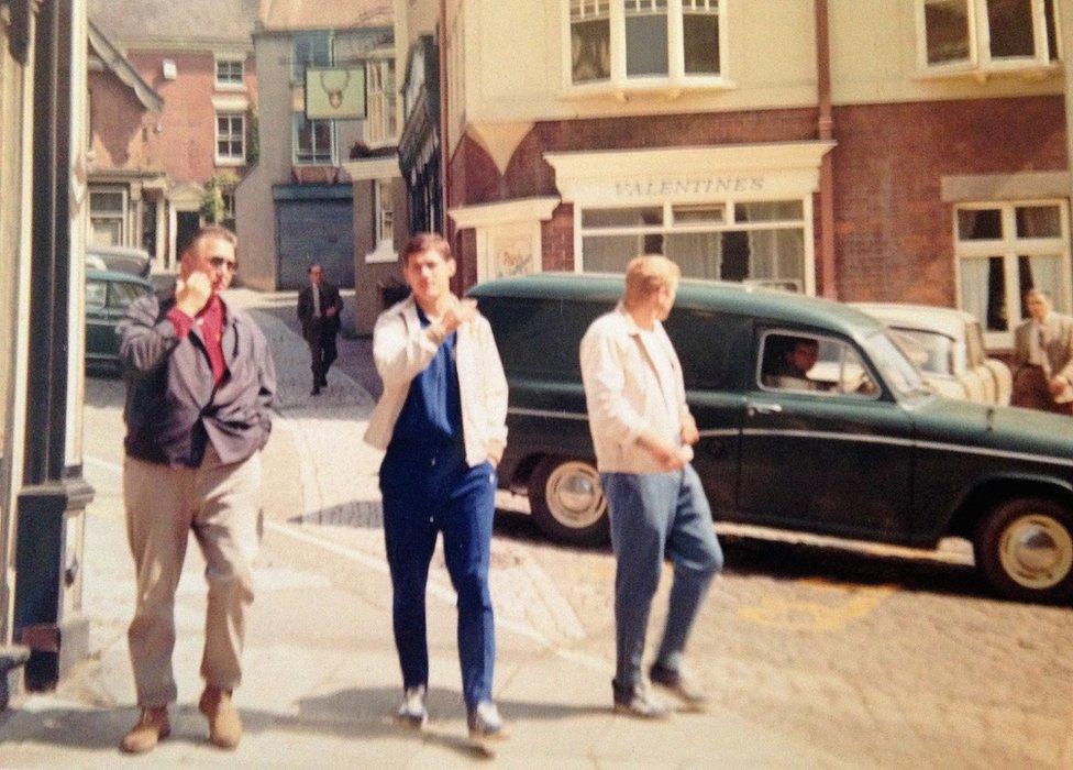 Helmut Haller (right) who scored in the final against England and Max Lorenz (middle) walk through Ashbourne