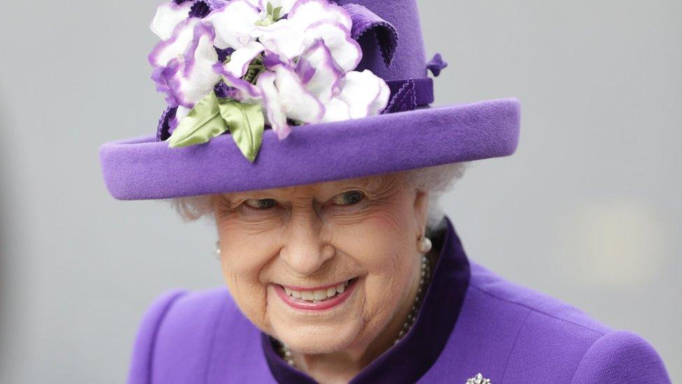 The Queen in a purple hat