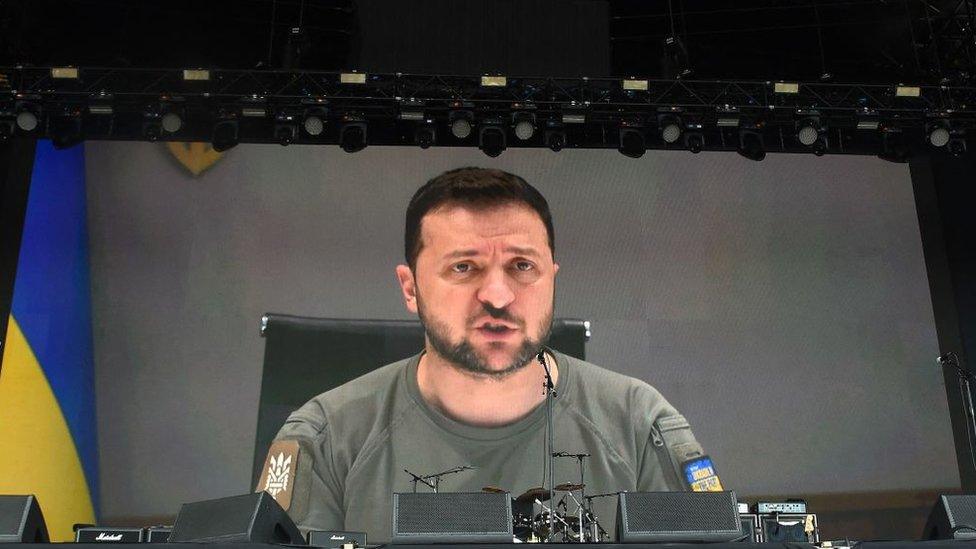 Ukraine's President Volodymyr Zelensky addresses festivalgoers via a video link during the Glastonbury festival