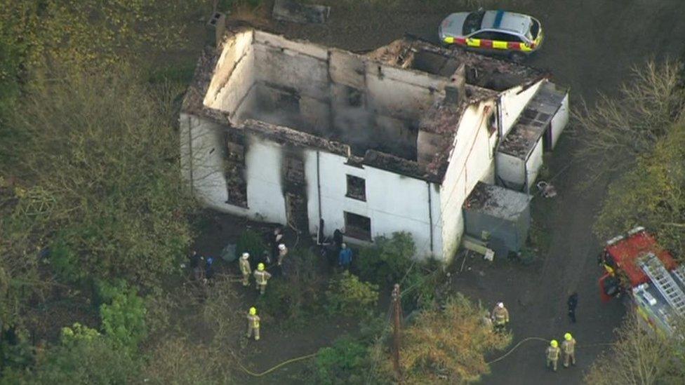 An aerial view of the house shows the devastation caused by the fire