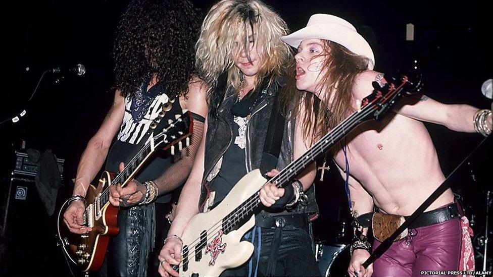 Slash, Duff McKagan and Axl Rose perform together in the 1980s