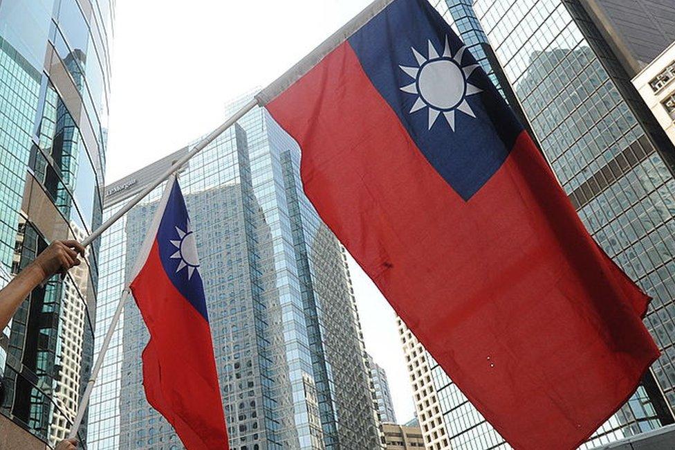 Protestors wave Taiwanese flags in Hong Kong on 17 September 2010.